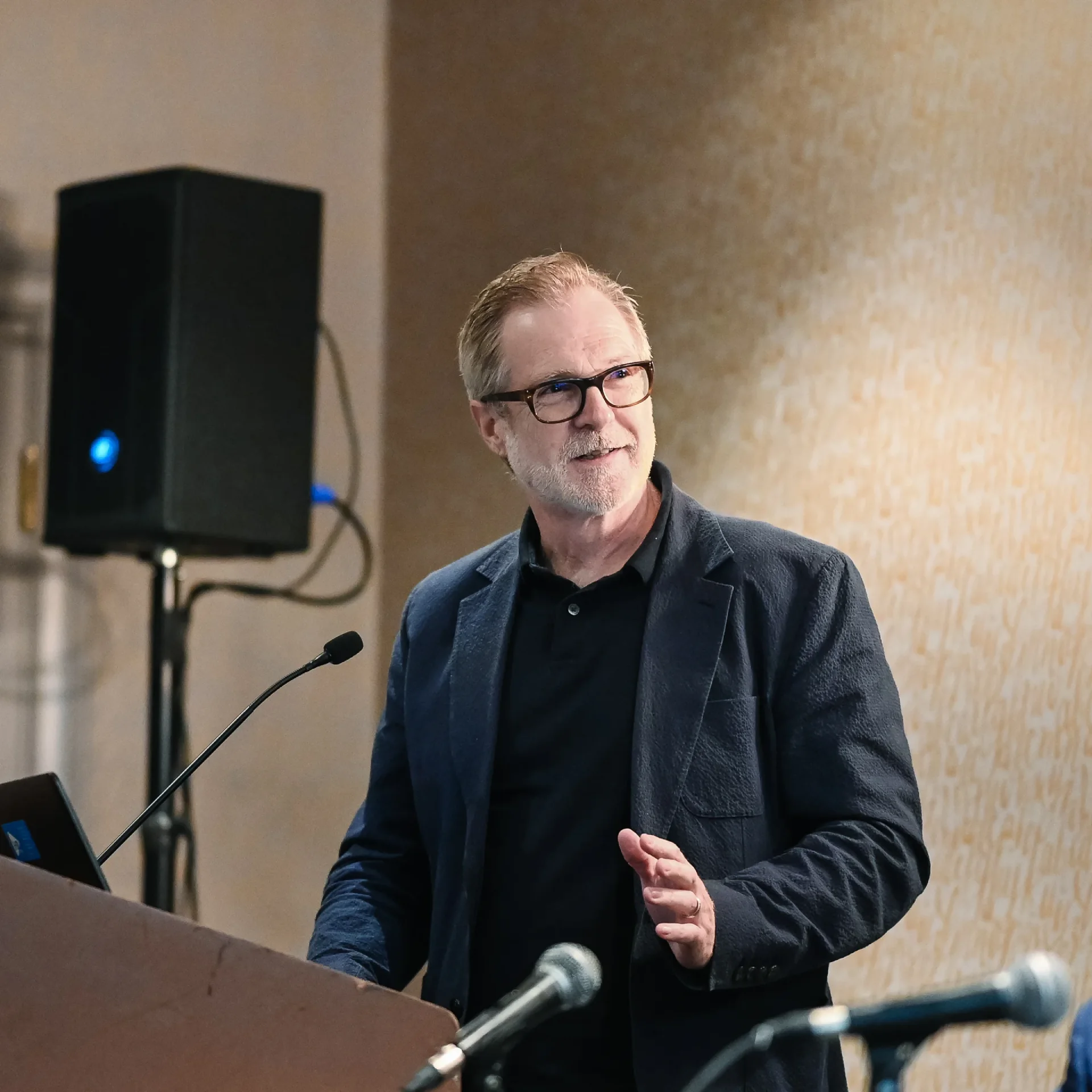 Phil Myrick speaking at a podium